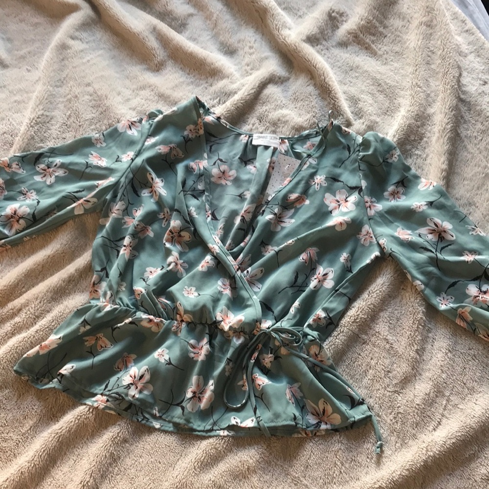 Sienna Sky Peplum Top. NWT